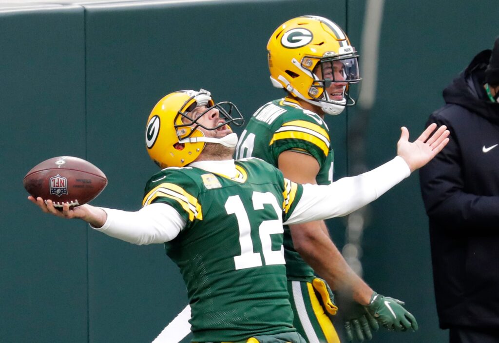 Green Bay Packers quarterback Aaron Rodgers celebrates scoring a touchdown with wide receiver Equanimeous St. Brown in the second quarter Sunday, Nov. 15, 2020, at Lambeau Field in Green Bay, Wis.